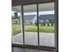Covered patio with sliding glass doors offers seamless indoor/outdoor living and neighborhood views at 7120 Wayfarer Dr # 0079, Charlotte, NC 28269