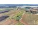 Aerial shot of a home nestled among fields with a long driveway at 760 Tomlin Mill Rd, Statesville, NC 28625