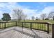 A view from the wood deck showing a large grassy area with trees in the distance at 760 Tomlin Mill Rd, Statesville, NC 28625