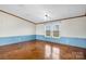 This bedroom has natural light, wood floors, neutral wall color, and is ready for your personal touches at 760 Tomlin Mill Rd, Statesville, NC 28625