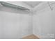 A walk-in closet features wire shelving units for optimum storage and neutral carpeting at 760 Tomlin Mill Rd, Statesville, NC 28625