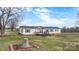 Classic single Gathering with welcoming front porch, surrounded by greenery and landscaping at 760 Tomlin Mill Rd, Statesville, NC 28625