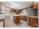 Well-equipped kitchen with wood cabinets, stainless steel refrigerator and a center island at 760 Tomlin Mill Rd, Statesville, NC 28625