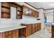 This kitchen features wood cabinets, laminate countertop and a large workspace at 760 Tomlin Mill Rd, Statesville, NC 28625