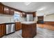 Eat-in kitchen with laminate floors, stainless steel appliances, an island and ample cabinet space at 760 Tomlin Mill Rd, Statesville, NC 28625