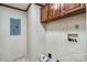 Functional laundry area equipped with wall-mounted cabinets and connections for a washer and dryer at 760 Tomlin Mill Rd, Statesville, NC 28625