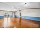 Spacious living room with wood floors, a ceiling fan, and access to the outside at 760 Tomlin Mill Rd, Statesville, NC 28625