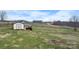 Outbuilding with shed and shelter, surrounded by greenery at 760 Tomlin Mill Rd, Statesville, NC 28625