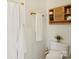 Clean bathroom featuring wood cabinet storage above the toilet and a shower at 971 Westmere Ave, Charlotte, NC 28208