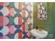 Chic powder room features unique wallpaper, gold fixtures, and pedestal sink at 971 Westmere Ave, Charlotte, NC 28208