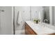 Modern bathroom featuring double sinks, white countertops, wood cabinets, and stylish fixtures at 971 Westmere Ave, Charlotte, NC 28208