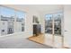 Bedroom with large windows leading to a balcony and a dresser at 971 Westmere Ave, Charlotte, NC 28208