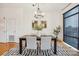 Bright dining room with modern chandelier, stylish rug, and hardwood flooring at 971 Westmere Ave, Charlotte, NC 28208