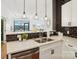 Close up on modern kitchen featuring stainless steel appliances, quartz countertops, and subway tile backsplash at 971 Westmere Ave, Charlotte, NC 28208