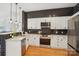 Bright kitchen featuring stainless steel appliances, quartz countertops, and subway tile backsplash at 971 Westmere Ave, Charlotte, NC 28208