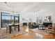 Spacious living room with open floor plan, hardwood floors, and modern furnishings at 971 Westmere Ave, Charlotte, NC 28208
