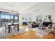 Bright and airy living room and dining area featuring large windows and hardwood floors at 971 Westmere Ave, Charlotte, NC 28208