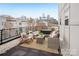 Relax on this condo's charming patio with stylish furniture and skyline views at 971 Westmere Ave, Charlotte, NC 28208