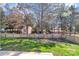 Large fenced backyard featuring a well-maintained lawn and lush landscaping with shed at 1027 Fountainbrook Dr, Indian Trail, NC 28079