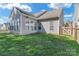 Fenced backyard featuring a well-maintained lawn and lush landscaping at 1027 Fountainbrook Dr, Indian Trail, NC 28079