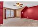 Bedroom featuring a unique ceiling, fan, window, and soft carpet, creating a relaxing atmosphere at 1027 Fountainbrook Dr, Indian Trail, NC 28079