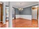 Elegant dining room with wainscoting, chandelier, and large windows at 1027 Fountainbrook Dr, Indian Trail, NC 28079