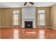 Spacious living room with a fireplace and hardwood floors at 1027 Fountainbrook Dr, Indian Trail, NC 28079