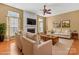 Cozy living room featuring a fireplace, ceiling fan, and comfortable seating at 1027 Fountainbrook Dr, Indian Trail, NC 28079