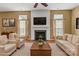 Bright and airy living room with a fireplace and neutral color palette at 1027 Fountainbrook Dr, Indian Trail, NC 28079