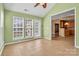 A sunroom with tile flooring leading to the back of the house and kitchen at 1027 Fountainbrook Dr, Indian Trail, NC 28079