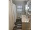 Updated bathroom with white vanity, marble countertop, and tile floor at 110 30Th Nw Ave, Hickory, NC 28601