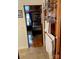 Small bathroom with wood paneling and access to bedroom at 110 30Th Nw Ave, Hickory, NC 28601