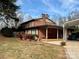 Brick home with covered patio and landscaping at 110 30Th Nw Ave, Hickory, NC 28601