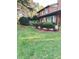 Landscaped front yard with brick walkway and manicured lawn at 110 30Th Nw Ave, Hickory, NC 28601