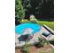 Inviting above ground pool with a large deck and patio furniture at 110 30Th Nw Ave, Hickory, NC 28601