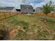 Large backyard with a view of the house and surrounding homes at 1112 Culver Spring Way, Charlotte, NC 28215