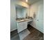 Bathroom vanity with granite countertop and large mirror at 1112 Culver Spring Way, Charlotte, NC 28215