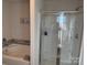 Bathroom with soaking tub and walk-in shower at 1112 Culver Spring Way, Charlotte, NC 28215