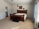 Bright bedroom with ensuite bathroom access at 1112 Culver Spring Way, Charlotte, NC 28215