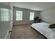 Bedroom with large windows, neutral walls, and carpet at 1112 Culver Spring Way, Charlotte, NC 28215