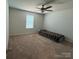 Bright bedroom with neutral carpeting and a ceiling fan at 1112 Culver Spring Way, Charlotte, NC 28215