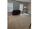 Bedroom with neutral carpeting, dresser, and standing desk at 1112 Culver Spring Way, Charlotte, NC 28215