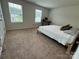 Well-lit bedroom with neutral decor and carpeted floor at 1112 Culver Spring Way, Charlotte, NC 28215