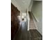 Entryway with dark hardwood floors, barn door, and carpeted stairs at 1112 Culver Spring Way, Charlotte, NC 28215