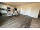 Modern kitchen with white cabinets, granite countertops, and stainless steel appliances at 1112 Culver Spring Way, Charlotte, NC 28215