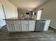 Large kitchen island with granite countertops and stainless steel dishwasher at 1112 Culver Spring Way, Charlotte, NC 28215