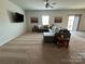 Living room with gray sectional sofa, carpet, and two wall art pieces at 1112 Culver Spring Way, Charlotte, NC 28215