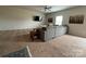 Spacious living room with gray sectional sofa and carpet at 1112 Culver Spring Way, Charlotte, NC 28215