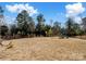 Spacious backyard featuring a playset and ample room for outdoor activities at 11317 Trailside Nw Rd, Huntersville, NC 28078
