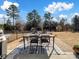 Inviting patio with outdoor dining set, perfect for entertaining on sunny days at 11317 Trailside Nw Rd, Huntersville, NC 28078